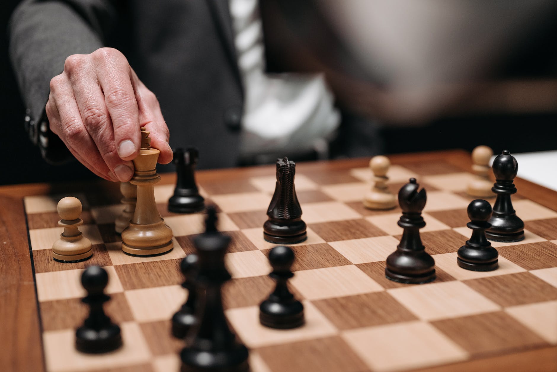 hand holding a chess piece